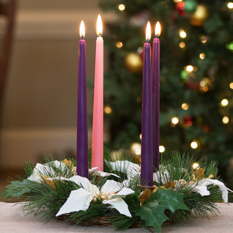 Advent candles, lit in a wreath, symbolize hope, love, joy and peace